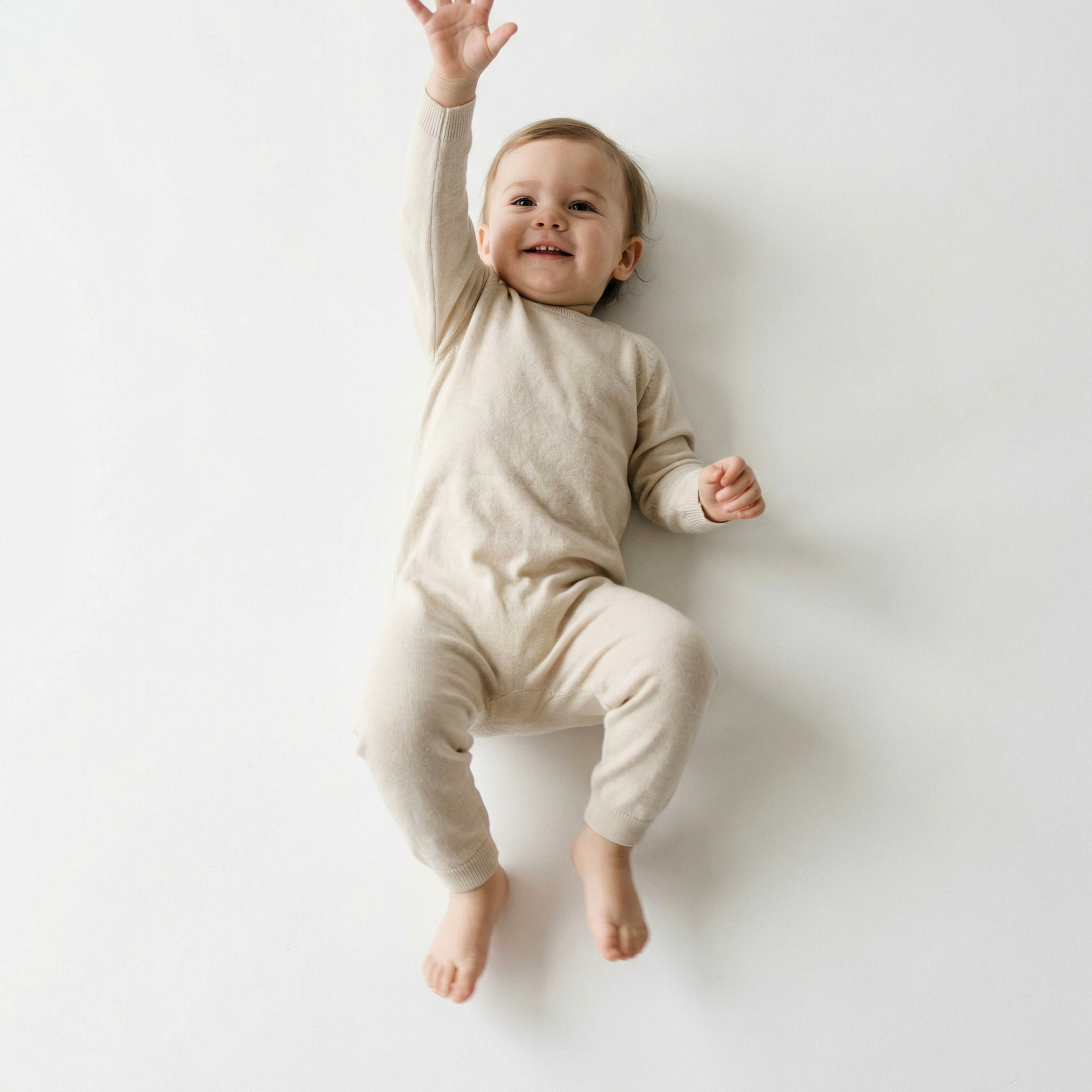 Baby lying on back joyful