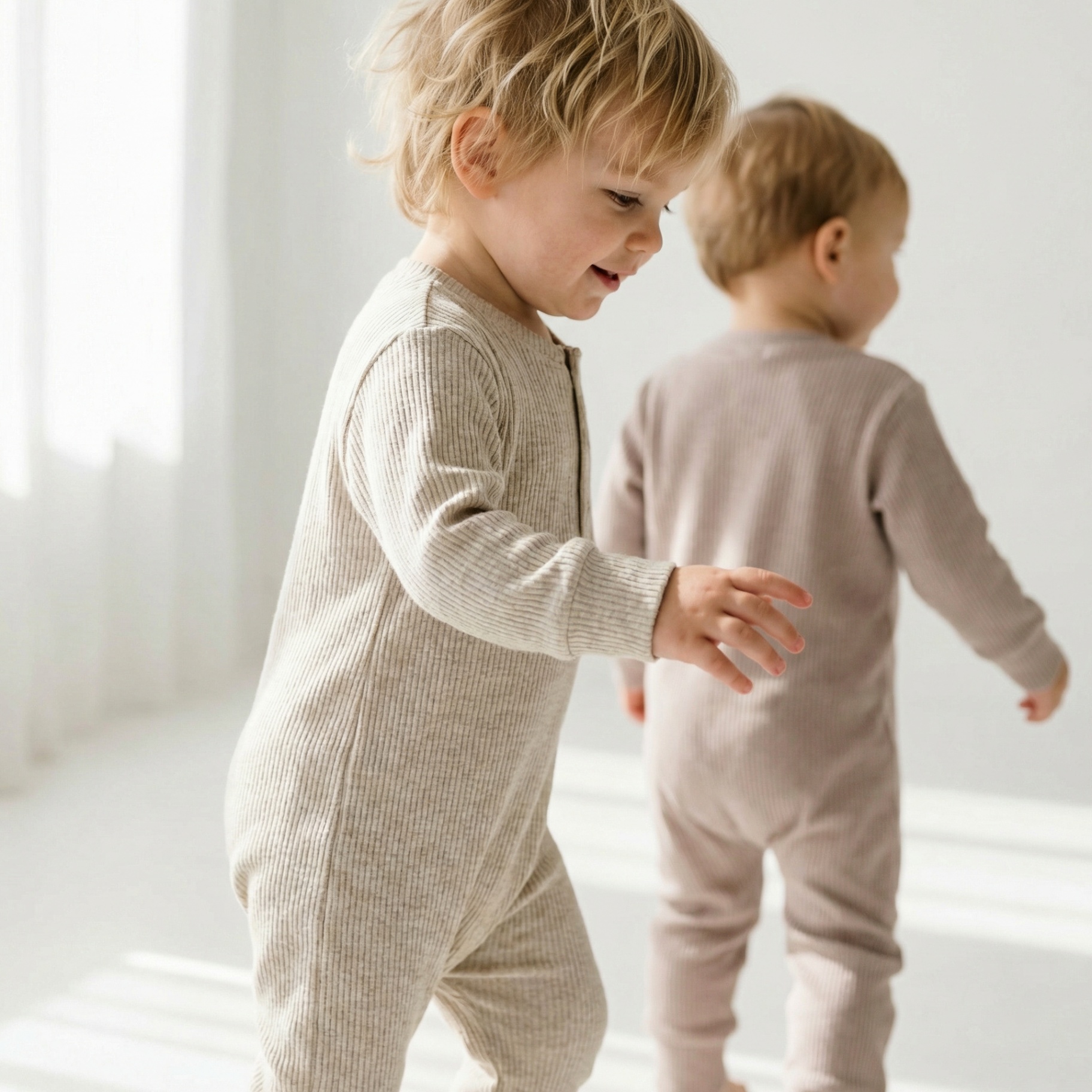 Two toddlers walking