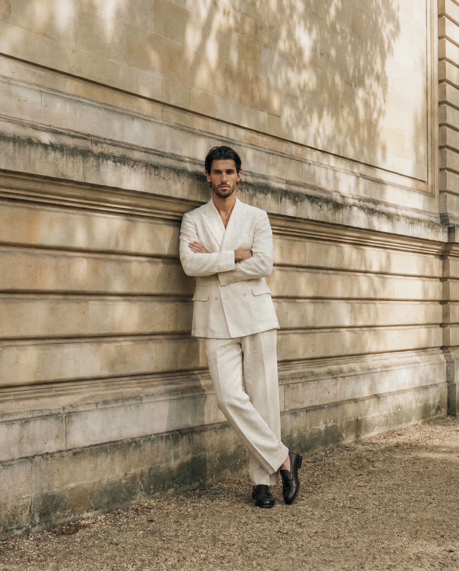 Ivory suit arms crossed